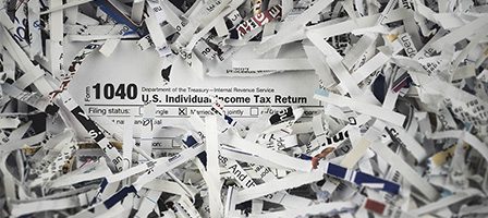 Torn paper revealing tax form