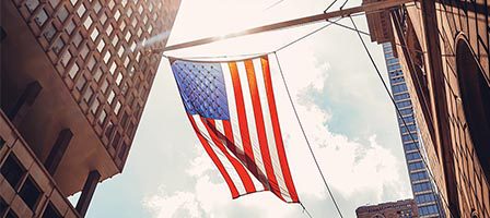 USA flag waving downtown
