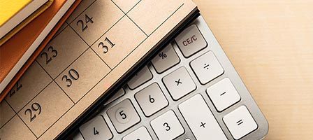 Office desk with calendar and keyboard