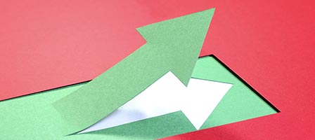 Green arrow pointing upward on red background