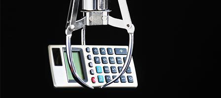 Claw machine holding a calculator
