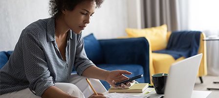Woman working at home with laptop