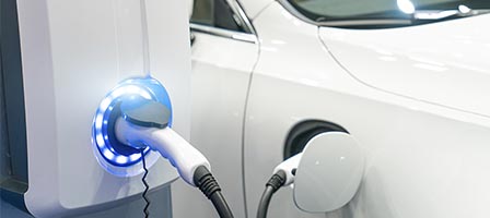 Electric car charging at station