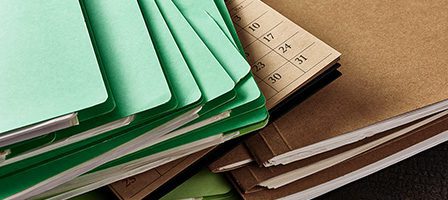 Stack of colorful folders and papers