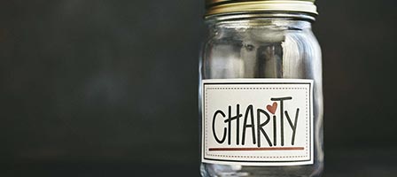 Charity donation jar with label