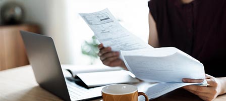 Person reviewing documents at a desk