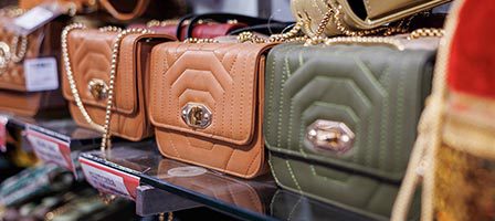 Assorted handbags on display shelf