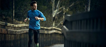 Runner in blue shirt outdoors