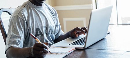 Individual using a laptop for work