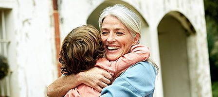 Warm family hug in the garden