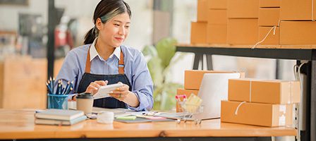 Small business owner preparing shipments