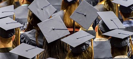 Graduates wearing caps at ceremony