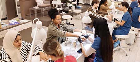 People receiving manicures at a salon
