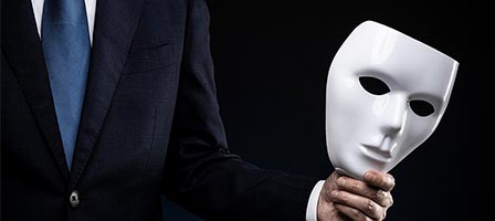 Person holding a white mask