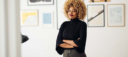 Woman standing confidently with arms crossed
