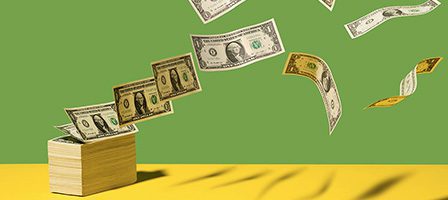 Flying dollar bills over a green background