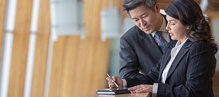 Business professionals reviewing documents together