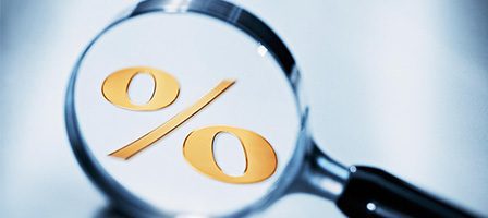 Magnifying glass over percentage symbol