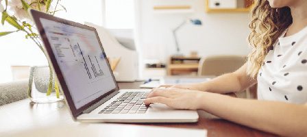 Person typing on laptop at desk