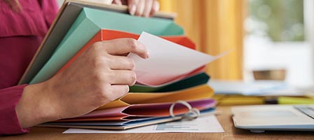 Filing papers in office setting