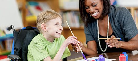 Creative art session with teacher and child
