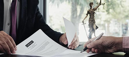 Legal documents being reviewed and signed