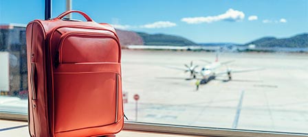 Travel bag overlooking runway scene