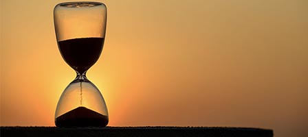 Time passing with sunset hourglass