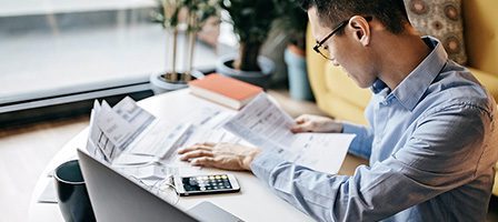 Man reviewing documents at a desk