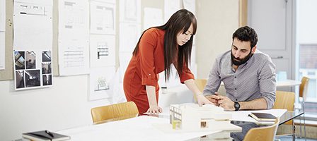 Architects discussing a project in office