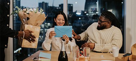 Smiling couple enjoying a surprise gift
