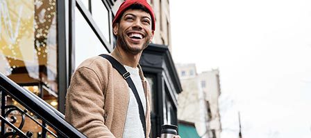 Cheerful person enjoying a walk downtown