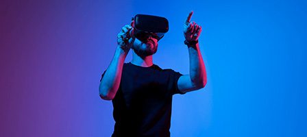 Man using VR headset with colorful lighting