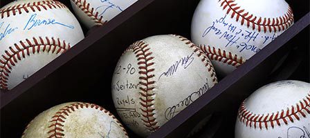 Signed baseballs in display case