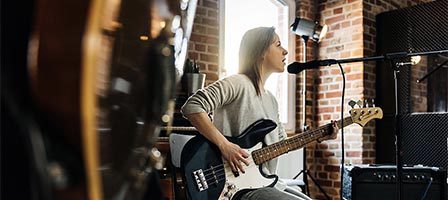 Woman performing with electric guitar