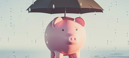 Saving money metaphor with umbrella