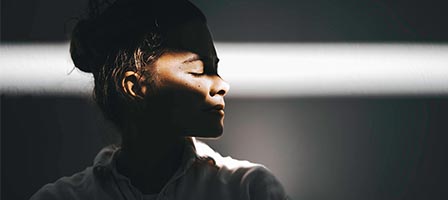 Person in shadow with dramatic lighting