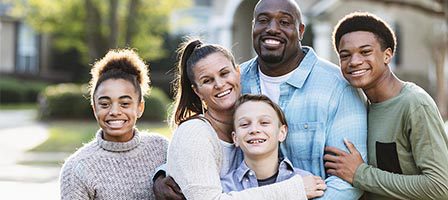 Smiling family group in a park