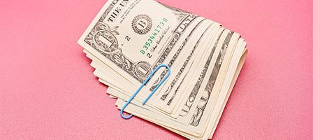 Stack of dollar bills with paperclip