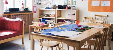 Classroom with wooden chairs and tables