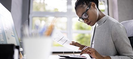 Focused professional reviewing paperwork