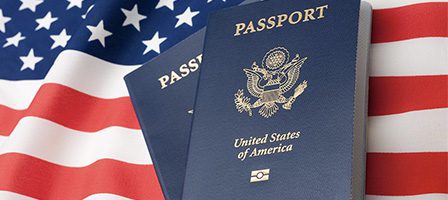 American passports with flag backdrop