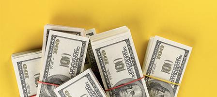 Bundles of cash with rubber bands