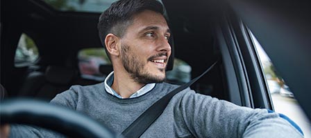 Driver looking out car window