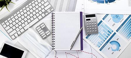 Business workspace with keyboard and notepad