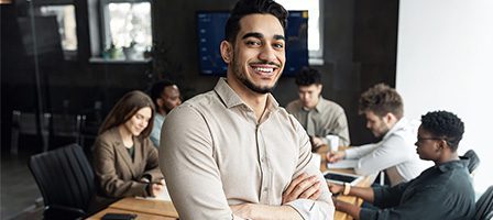 Confident businessman at team discussion