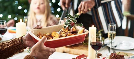 Christmas table with candles and wine