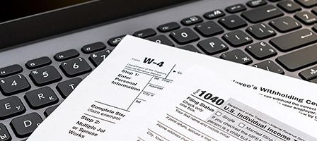 W-4 and 1040 tax documents displayed