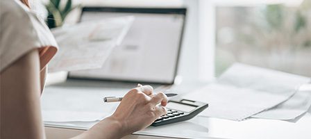 Desk with laptop and paperwork