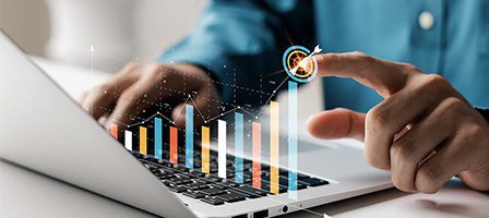 Hand pointing at digital bar graph